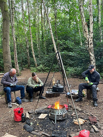 woodland wellbeing wood carving around the campfire