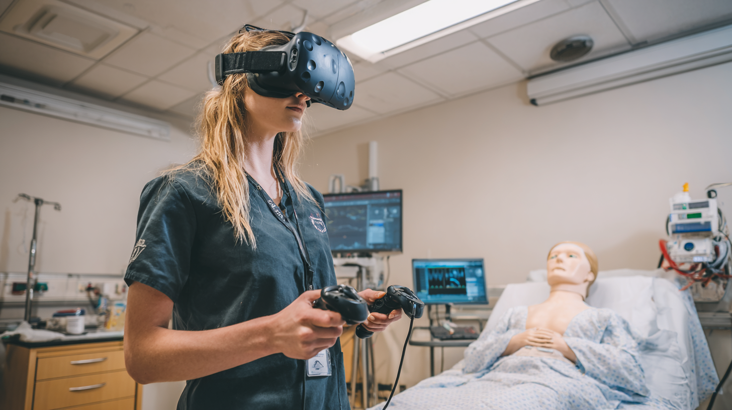 A medical trainee practicing inside a VR simulation while standing beside a real clinical mannequin in a training lab.