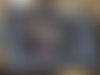 A realistic 3D studio shot showing a creature rigging workspace with clean topology, joint structures, and technical rig controls.