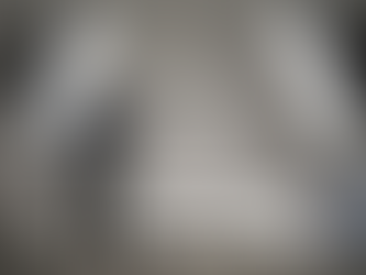 A realistic photogrammetry setup with a camera, turntable, lighting, and reference markers used to capture objects for 3D reconstruction.