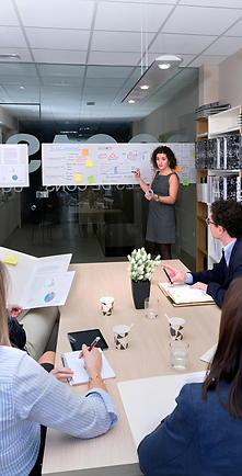 female-coach-training-business-team-sitting-table-with-documents-headquarters_156252-2638.