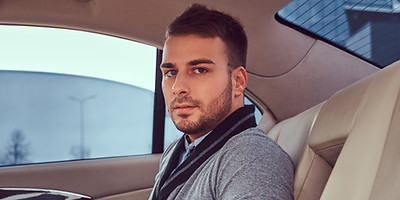 handsome-fashionable-male-elegant-clothing-sitting-car.jpg