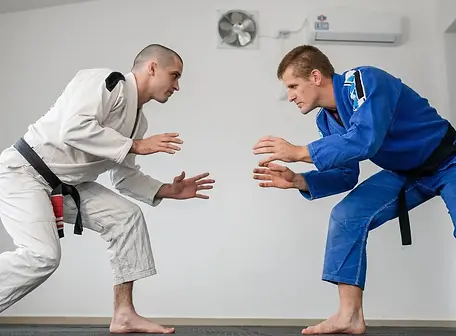 two-men-playing-brazilian-jiu-jitsu-Complete-Pilates.webp