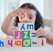 child with building blocks