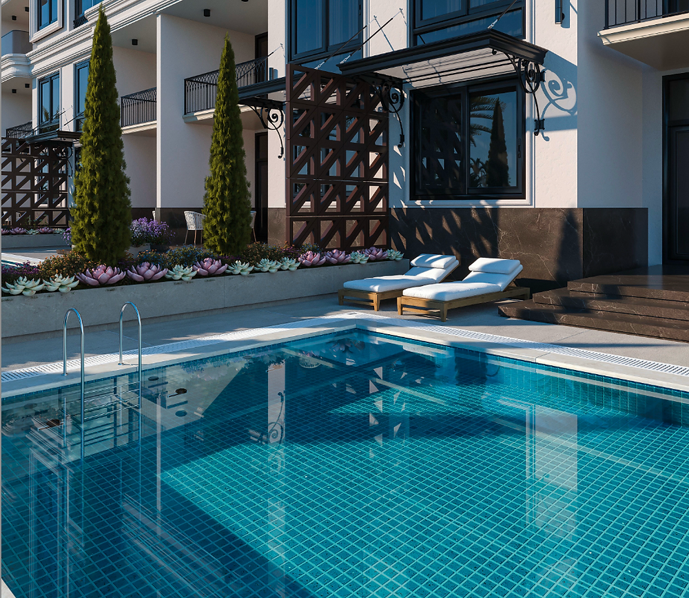 Poolside lounge area with sunbeds and modern apartment building in Hurghada