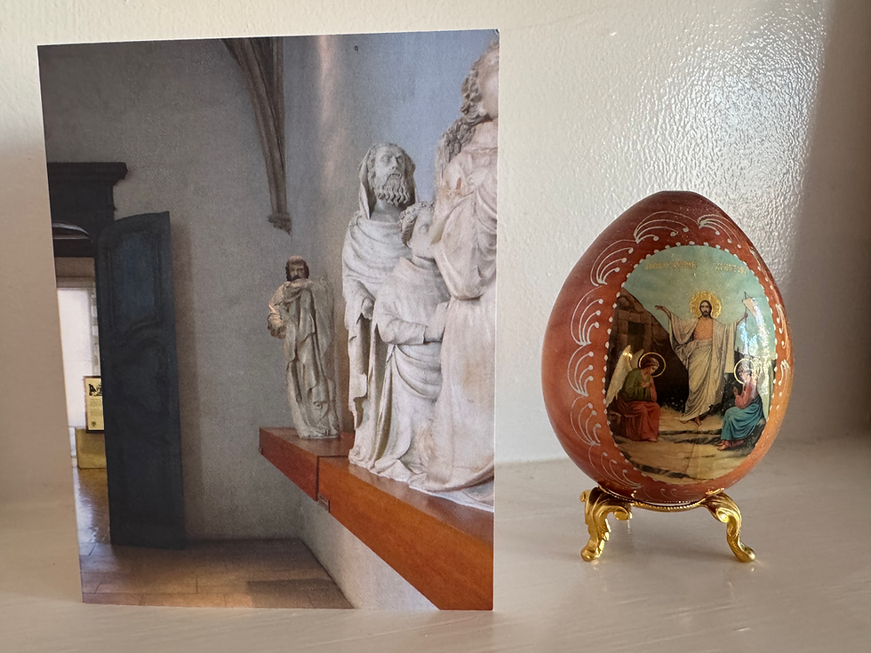Thumbnail: Card of photo of room with 14th century statuary along right wall, door on left in background, on mantle with colors behind