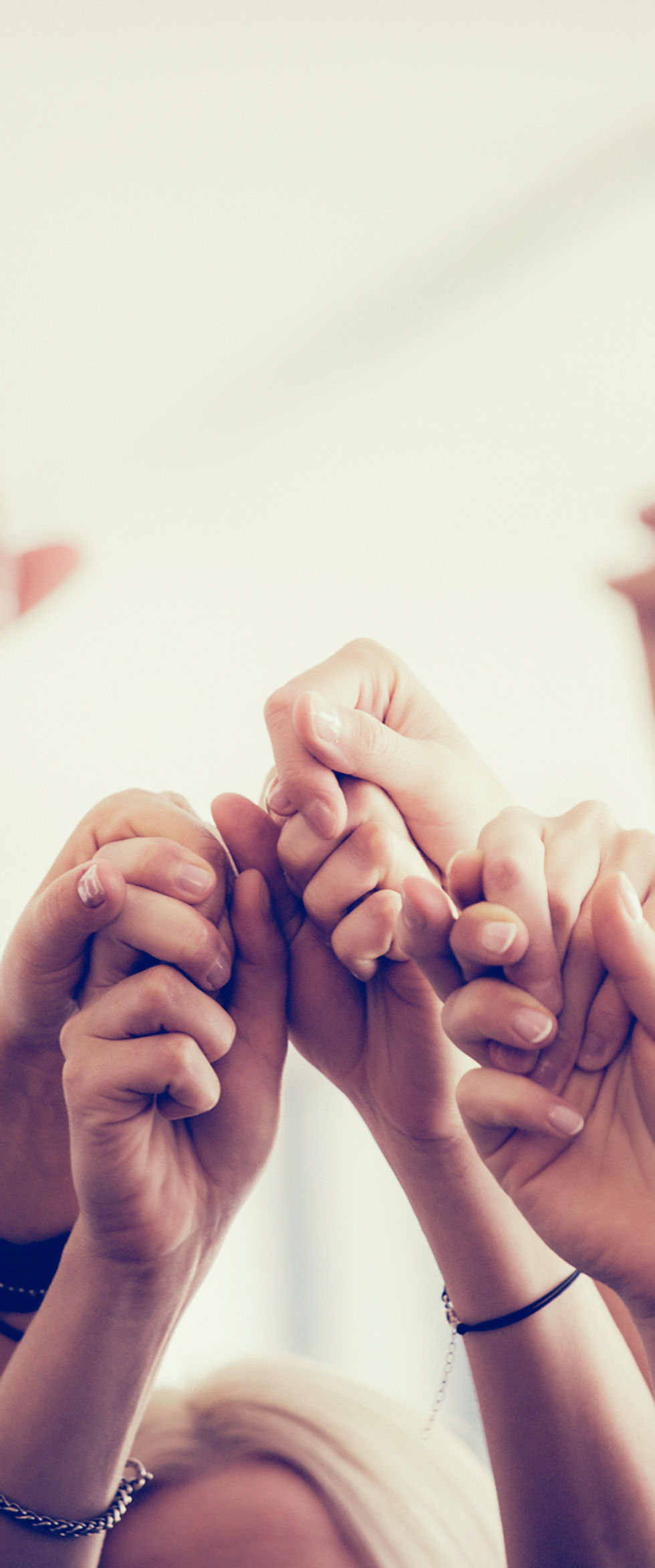 Women Holding Hands