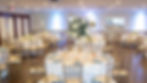 Elegant room with round tables set for private events.