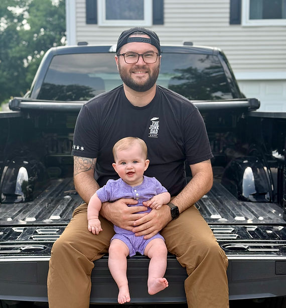 The Junk Dad founder RJ Krempasky with his daughter in his pickup truck