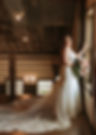 Columbus Ohio Wedding Venue. Bride at barn wedding venue poses with flower bouquet for rustic wedding