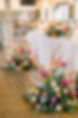 Columbus Ohio Wedding Venue. Floral arrangements at head table for bride and group at rustic barn venue.