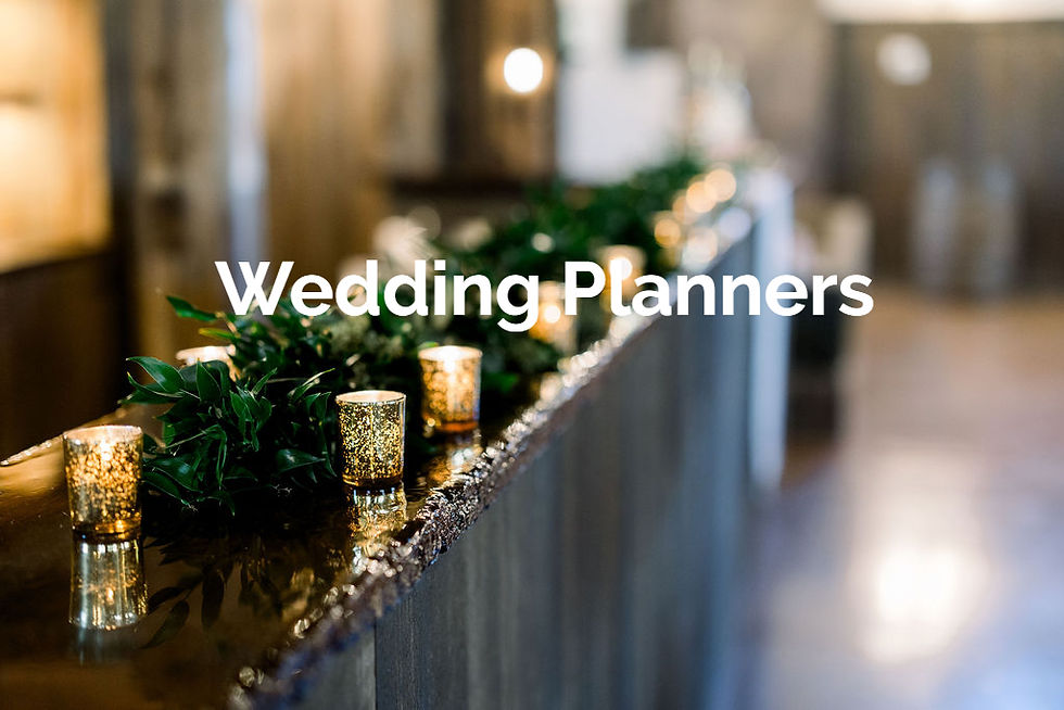 Pickaway County Wedding Venue Decorative candles and greenery on a wedding reception table with Wedding Planners text over a softly lit hallway.