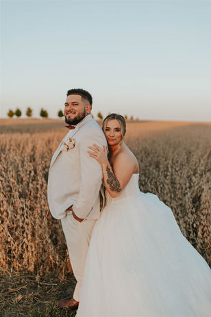 Bride and groom in soybean field at Circleville wedding venue