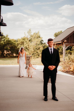 First look with bride and groom at Columbus wedding venue with gardens