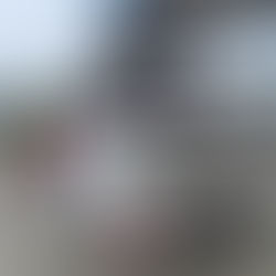 A logistics truck parked at a service area, loaded and ready for transport.