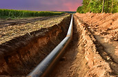Construction Gas Pipeline Project on amazing sunset background. Natural Gas and Crude oil