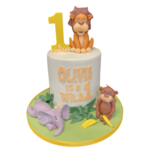 A vibrant and fun safari-themed cake featuring cute and colourful wild animals for a wild one celebration. Perfect for a jungle or safari themed party.
