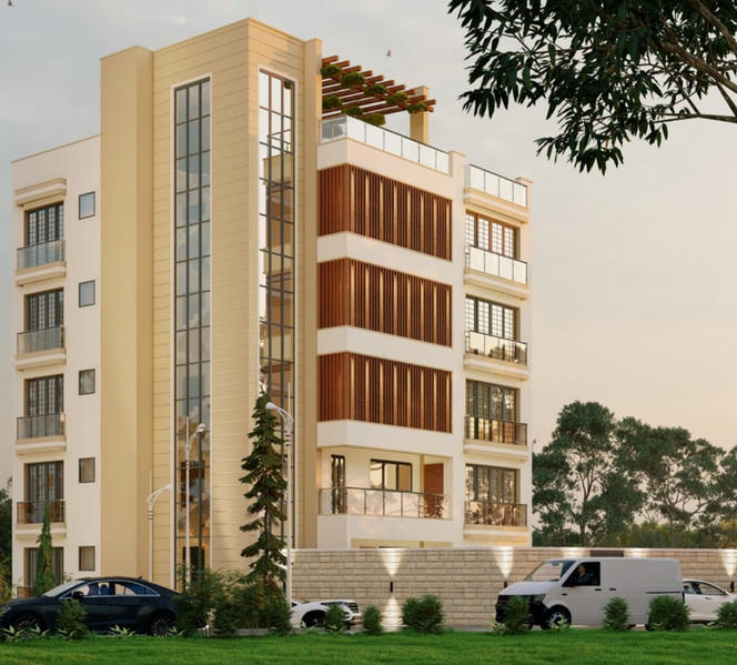 Modern beige building with glass windows, cars parked, tree, and sunny sky