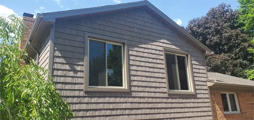 Energy-efficient two-lite beige slider replacement windows with lifetime warranty