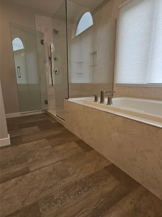 Luxury vinyl plank flooring installed in modern bathroom renovation

