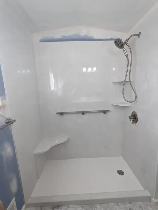 White cultured marble shower in Metro Detroit bathroom remodel
