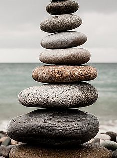 Stones balanced and stacked on a beach