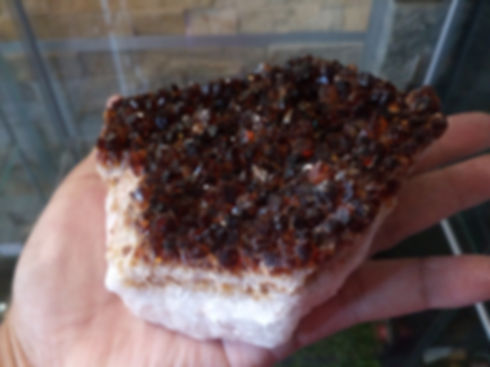 Smoky quartz cluster on hand