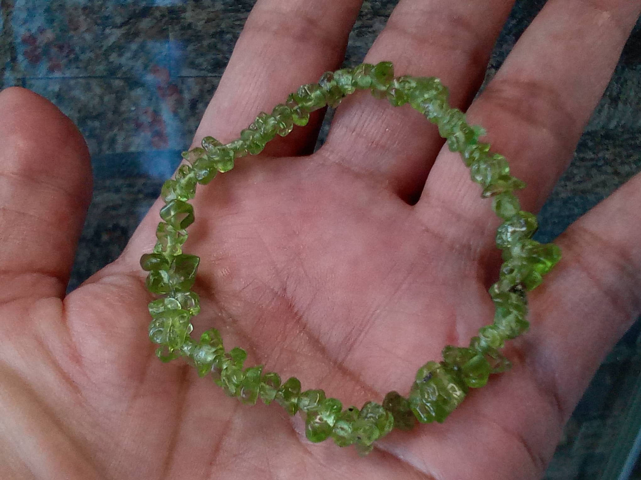 Green gemstone bracelet on hand