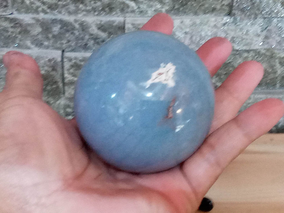 Thumbnail: Large blue Amethyst sphere in hand