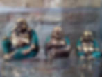 Three brass laughing Buddha statues