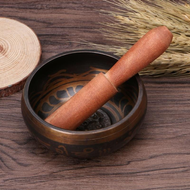 Singing bowl with wooden striker