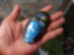 Thumbnail: Hand holding polished blue Labradorite