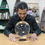Thumbnail: Man examining large crystal ball