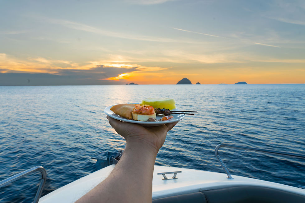 person-holding-plate-food-cruise-ocean-with-samosa-satay-melon-bruschetta.jpg