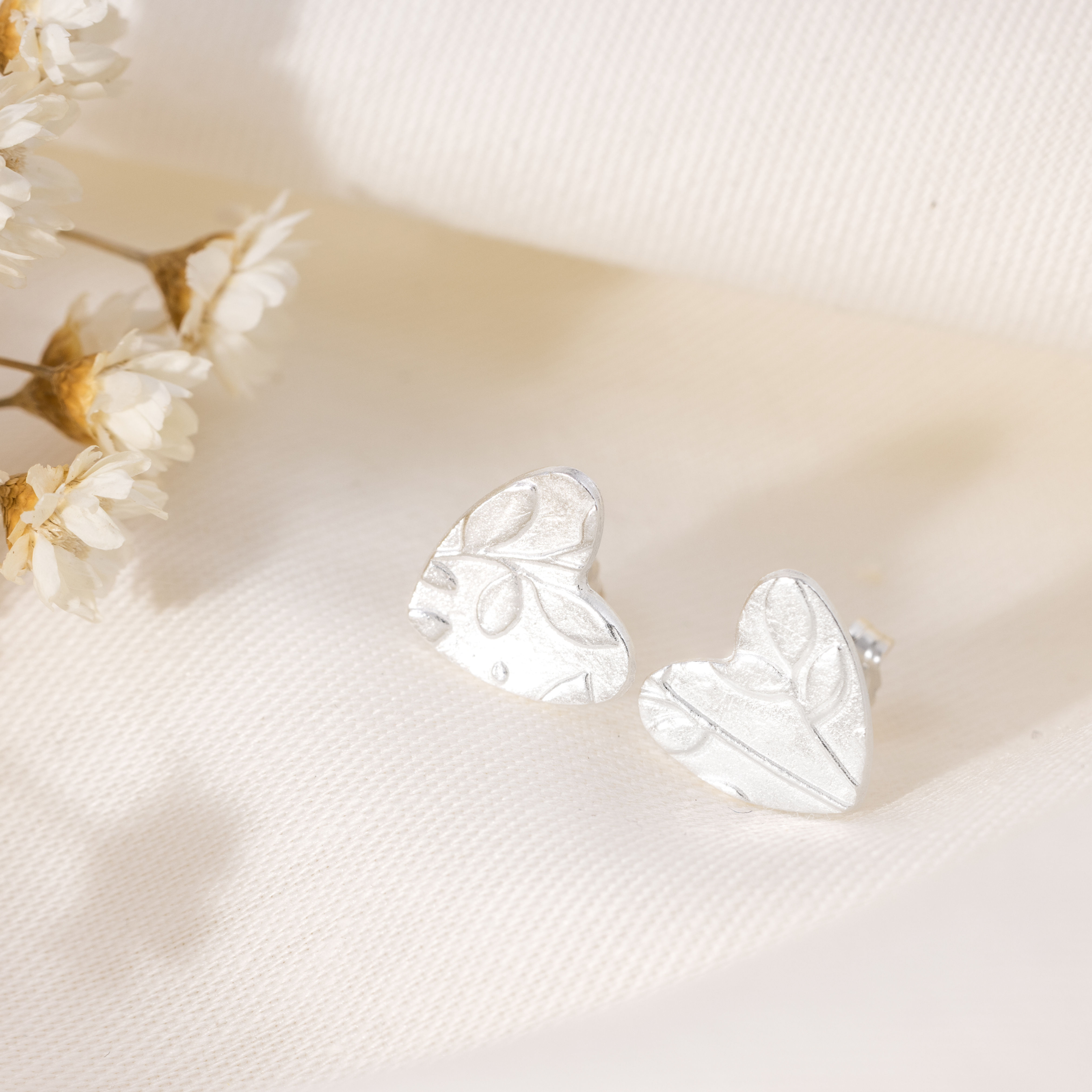 SOLD - Leafy heart stud earrings