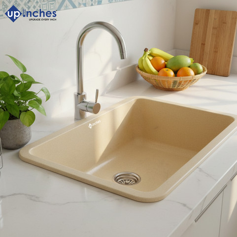 Beige quartz kitchen sink installed with pull-down faucet on polished stone countertop, modern and elegant kitchen setup.