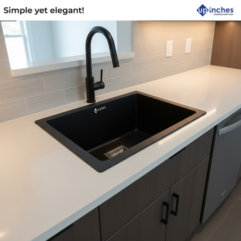Black quartz kitchen sink installed on countertop with steel faucet, elegant and modern kitchen design.