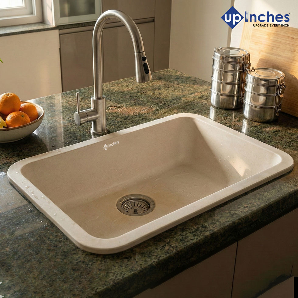 White quartz kitchen sink installed with pull-down faucet on polished stone countertop, bright and modern kitchen setup.