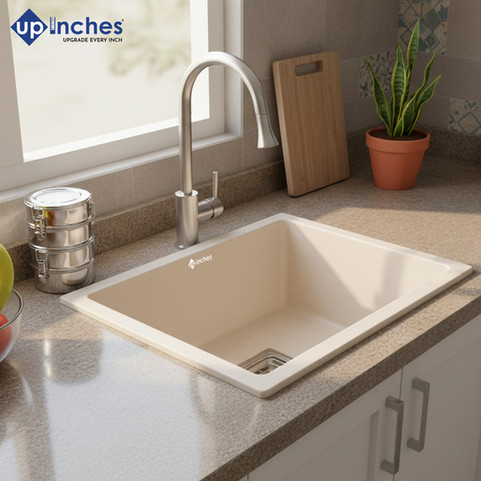 white quartz kitchen sink installed with chrome faucet, demonstrating easy cleaning while washing fresh produce.