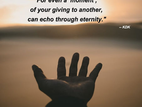 A man's hand reaching out into space in front of him.