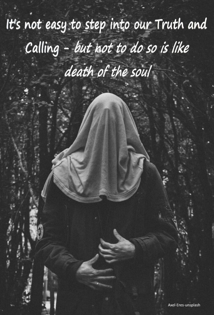 Man standing with a sheet over his head in a forest.