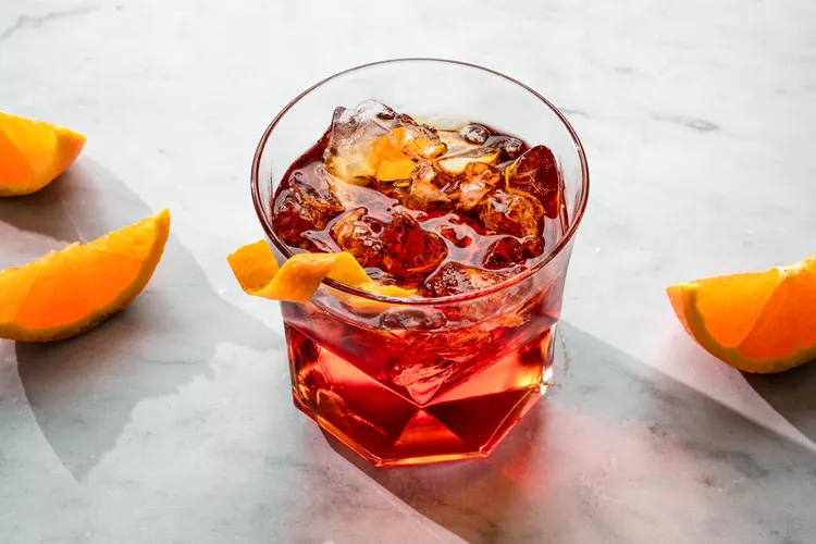 negroni-cocktail-recipe-759327-step-04-bb2a444c1d6f49eab39e0ddfd099f93b.webp