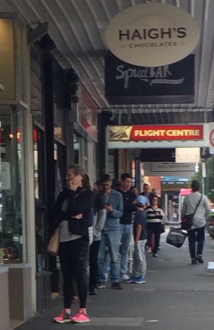 Spaced-out queue outside of Haigh's Chocolates, 715 Glenferrie Road.