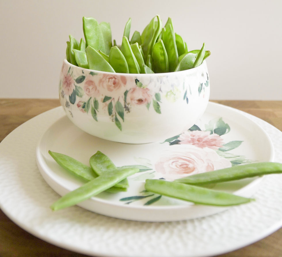 Ladylike Bone China bowl with floral pattern, filled to the brim with sugar snap peas – a visual take on peas in a pod, just like two reunited, long-lost cousins.