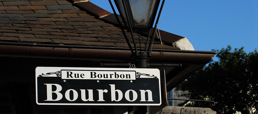 Bourbon Street street sign at Lafitte's Blacksmith Shop.jpg