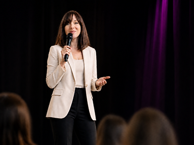 Maureen Benedict Speaking on stage