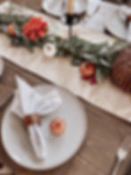 Dining table set with pumpkins for the fall season.