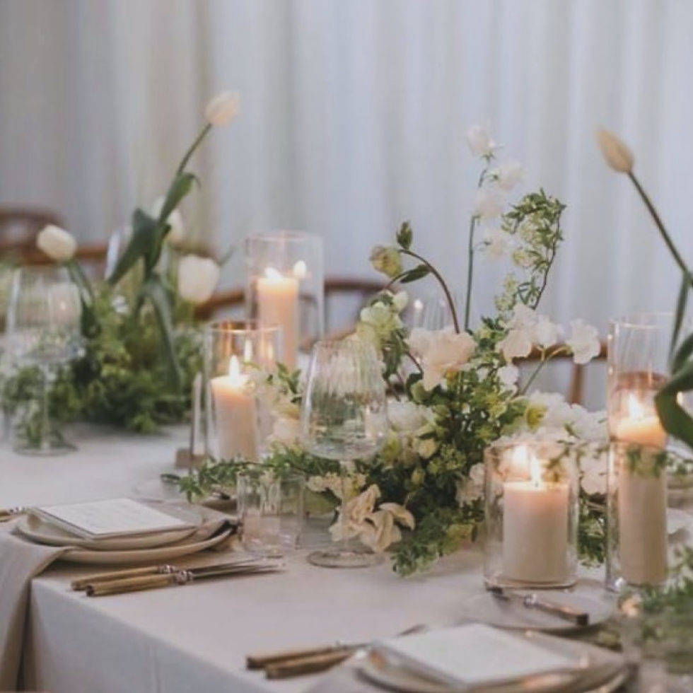 Simple vased flowers and candles centerpieces - Malibu reception