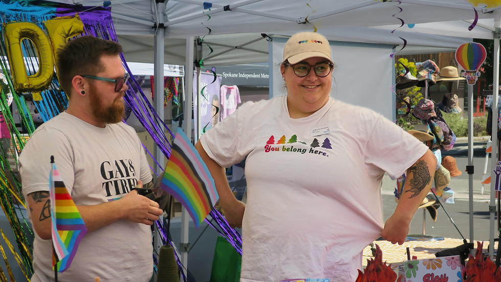 Vendors chat with attendees at Pride In Perry 2024.