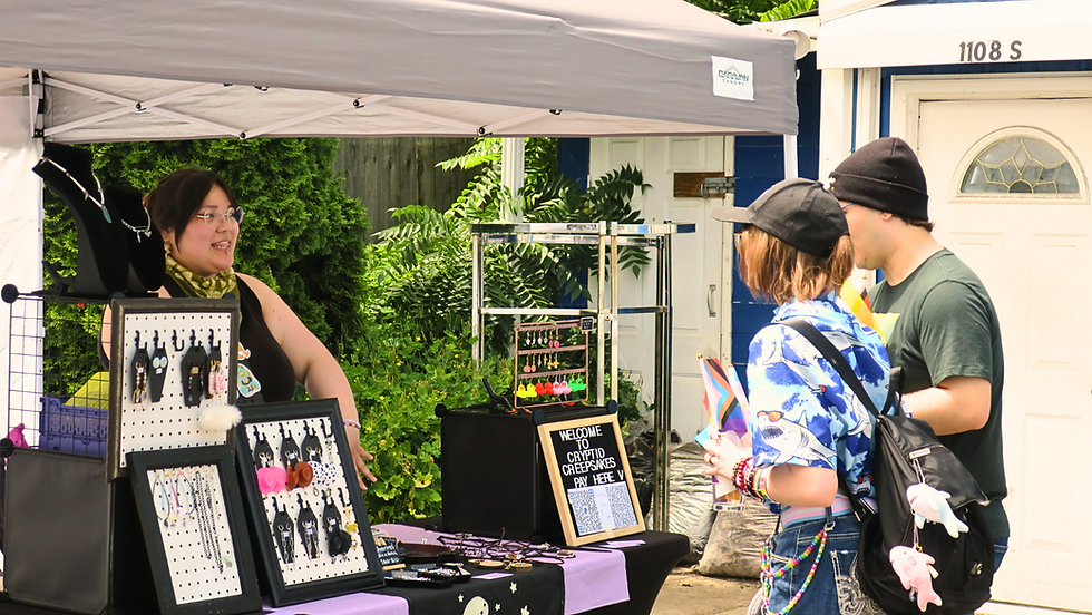 Attendees speak to a vendor during Pride In Perry 2024.